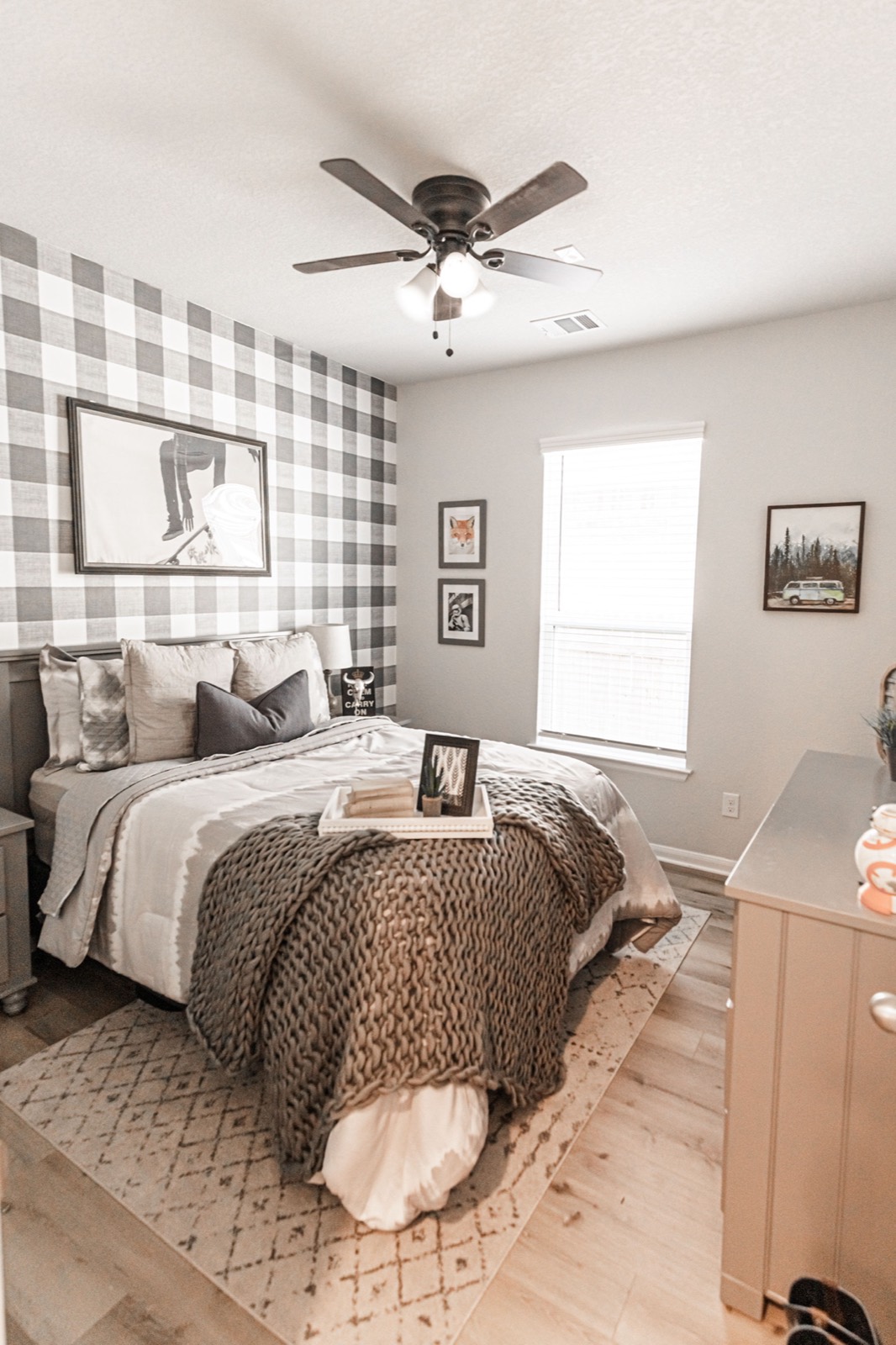 Cozy designed bedroom with plaid accent wall